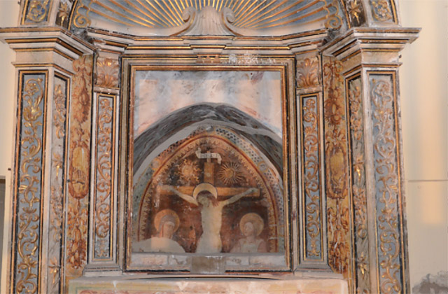 La “Crocifissione”, affresco del '400 di scuola marchigiana presente nella chiesa del SS. Crocifisso a Ostra Vetere